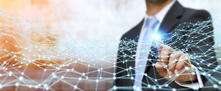 Businessman on blurred background touching flying network dot 3D renderingの写真素材