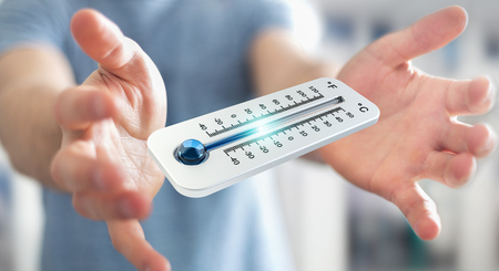 Businessman checking the temperature drop with a thermometer 3D renderingの写真素材