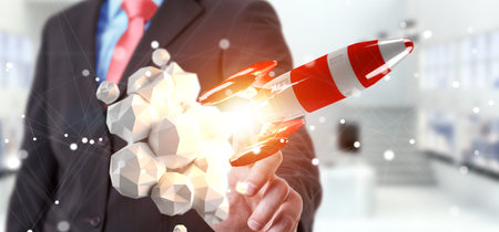 Businessman on blurred background holding red rocket in his hand 3D rendering