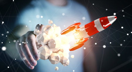 Businessman on blurred background holding red rocket in his hand 3D rendering