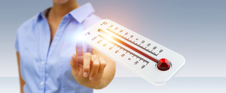Businessman checking the temperature rise with a thermometer 3D renderingの写真素材