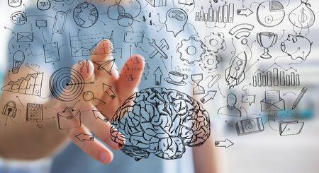 Businessman on blurred background touching manuscript project presentation with his fingersの写真素材