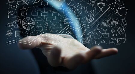 Businessman on blurred background holding manuscript project presentation with his handの写真素材