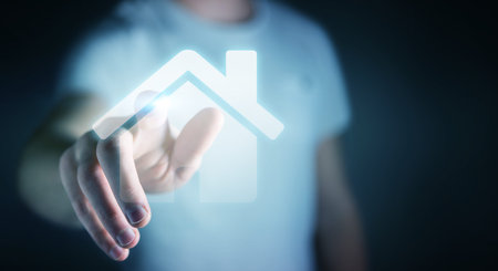 Businessman on blurred background touching 3D rendering icon house with his finger