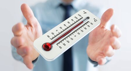 Businessman checking the temperature rise with a thermometer 3D renderingの写真素材