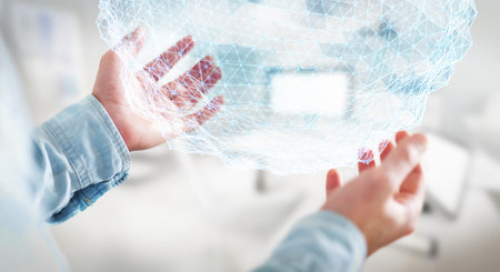 Businessman on blurred background holding flying network sphere 3D renderingの写真素材