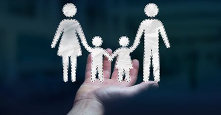 Businessman on blurred background holding family interface in his hand 3D renderingの写真素材