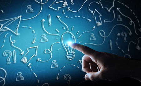 Businessman on blurred background touching hand drawn lightbulb and arrows with his finger