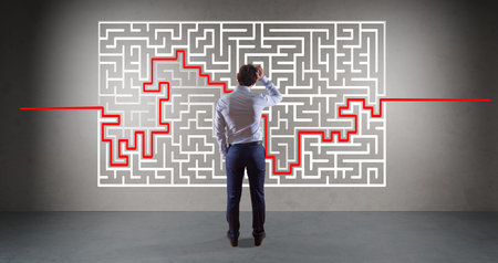 Businessman in modern interior searching maze solution on a wall 3D rendering