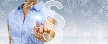 Businesswoman on blurred background touching law protection right symbolの写真素材