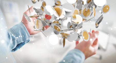 Businessman on blurred background holding flying currency coins in his hand 3D renderingの写真素材