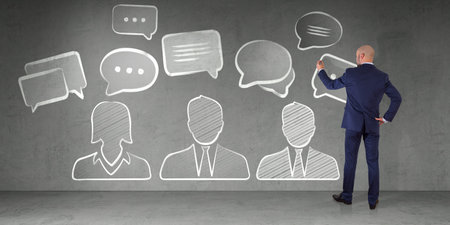 Businessman in modern interior drawing discussion icons sketch on a wall 3D renderingの写真素材