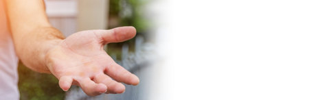 Panorama view of empty businessman hand on blurred background