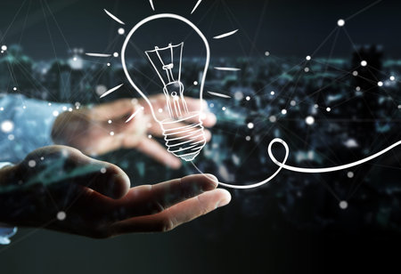 Businessman on blurred background holding a sketch lightbulbの写真素材