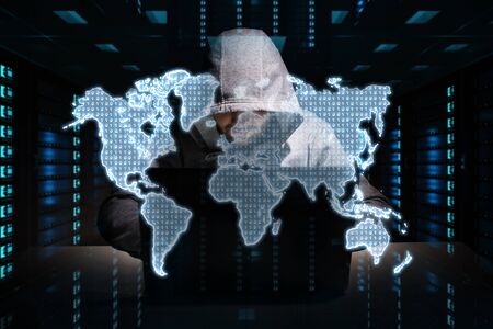 Hacker accessing to personal data information with a computer in a dark room 3D renderingの写真素材