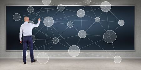 Businessman in modern interior using social network interface on a board 3D renderingの写真素材