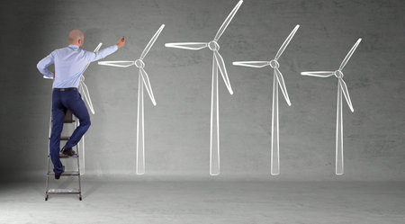 Businessman in modern interior drawing renewable energy sketch on a wall 3D renderingの写真素材
