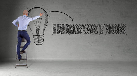 Businessman in modern interior drawing innovation sketch on a wall 3D renderingの写真素材