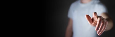 Panorama view of businessman pointing finger on blurred backgroundの写真素材