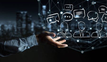 Businessman on blurred background holding discussion icons sketchの写真素材