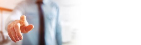 Panorama view of businessman pointing finger on blurred backgroundの写真素材