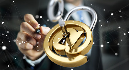 Businessman on blurred background using 3D rendered digital padlock to secure his internet datasの写真素材