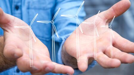 Businessman on blurred background hloding renewable energy sketchの写真素材