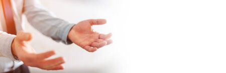 Panorama view of empty businessman hand on blurred backgroundの写真素材