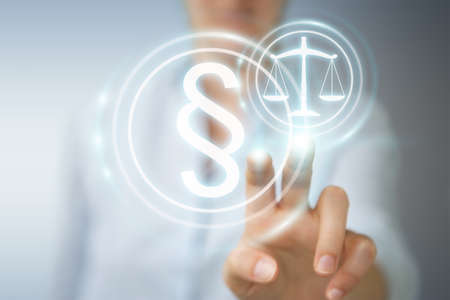 Businesswoman on blurred background holding and touching 3D rendering law symbolの写真素材