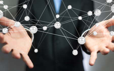 Businessman on blurred background using flying network balls connection 3D renderingの写真素材