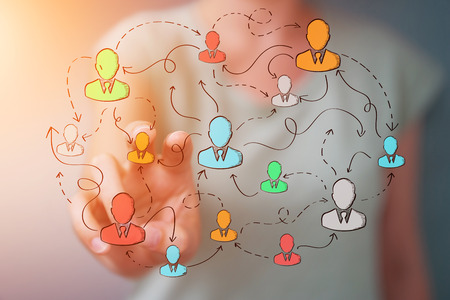 Businesswoman on blurred background using hand drawn social network interfaceの写真素材