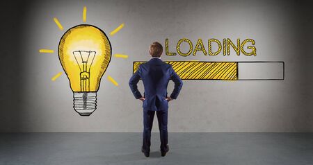 Businessman in modern interior watching loading sketch on a wall 3D renderingの写真素材