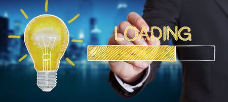 Businessman on blurred background drawing loading sketchの写真素材