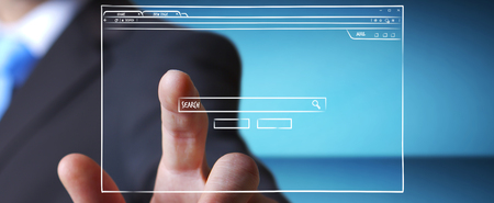 Businessman on blurred background holding and touching a website page sketchの写真素材