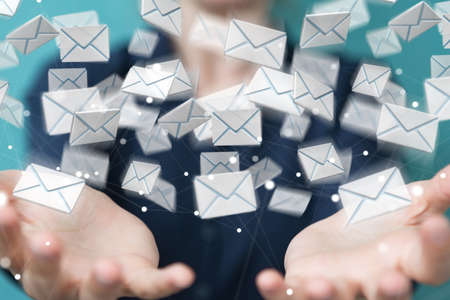 Businesswoman on blurred background holding and touching 3D rendering flying emailの写真素材