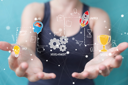 Businesswoman on blurred background using manuscript project presentation with her handの写真素材