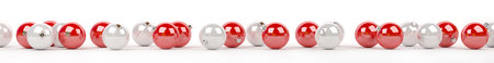 Red and white christmas baubles lined up on white background 3D rendering