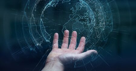 Flying earth network interface activated by businessman on blurred background 3D renderingの写真素材