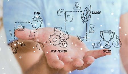 Businessman on blurred background using manuscript project presentation with his handの写真素材