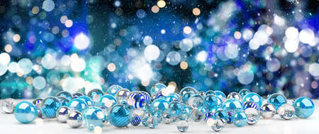 Blue and white christmas baubles on snowy background 3D renderingの写真素材
