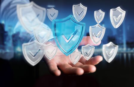 Businessman on blurred background using modern data shield antivirus 3D renderingの写真素材