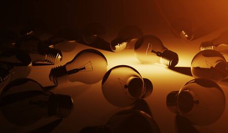 Bright lightbulb illuminating other bulbs with orange light 3D renderingの写真素材