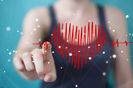 Businesswoman on blurred background touching and holding heart beat sketchの写真素材