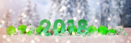 2018 new year eve with green and white christmas baubles and candles 3D renderingの写真素材