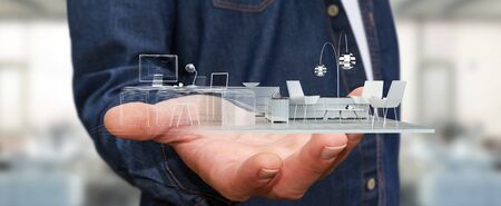 Businessman on blurred background holding white 3D rendering apartmentの写真素材