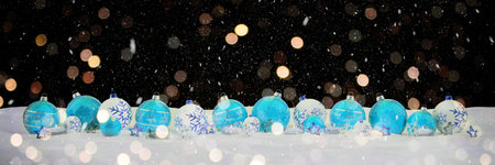 Blue and white christmas baubles and candles on snow background 3D rendering