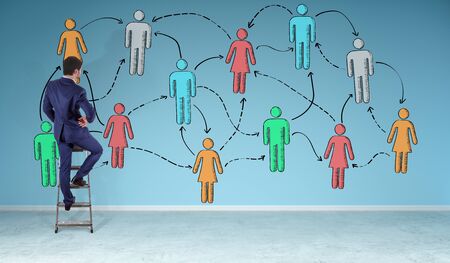 Businessman in modern interior watching social network sketch on a wall 3D renderingの写真素材