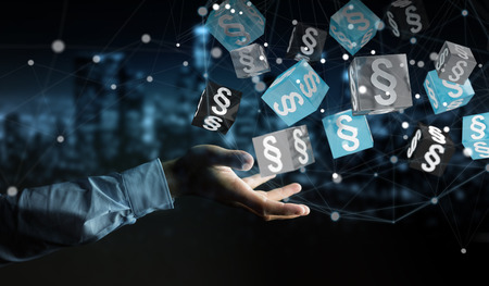 Businessman on blurred background holding and touching 3D rendering law cubesの写真素材