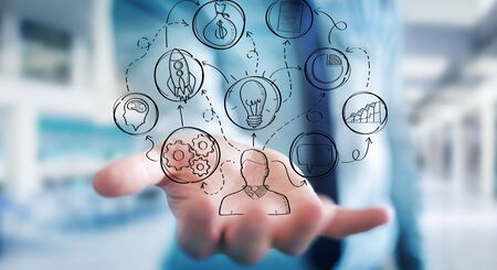 Businessman on blurred background using manuscript project presentation with his handの写真素材