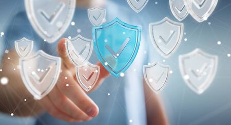 Businessman on blurred background using modern data shield antivirus 3D renderingの写真素材